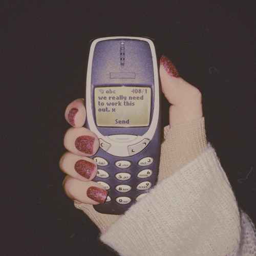 An old mobile phone with a half-sent message